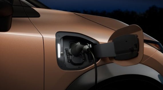 Close-up image of charging cable plugged in | Fort Worth Nissan in Fort Worth TX