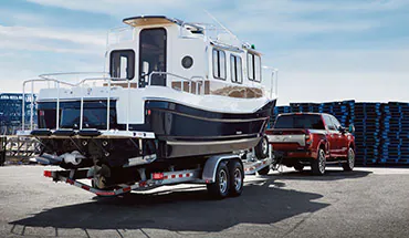 2022 Nissan TITAN Truck towing boat | Fort Worth Nissan in Fort Worth TX