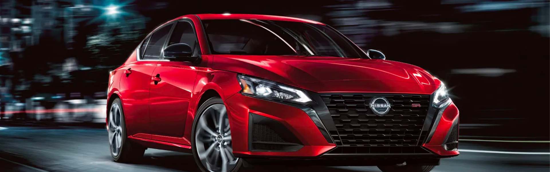 A white car driving on the road.