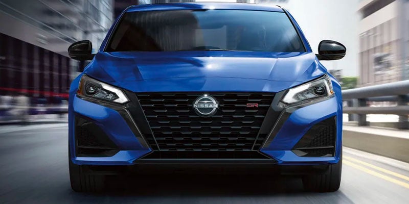 A blue car sitting parked.