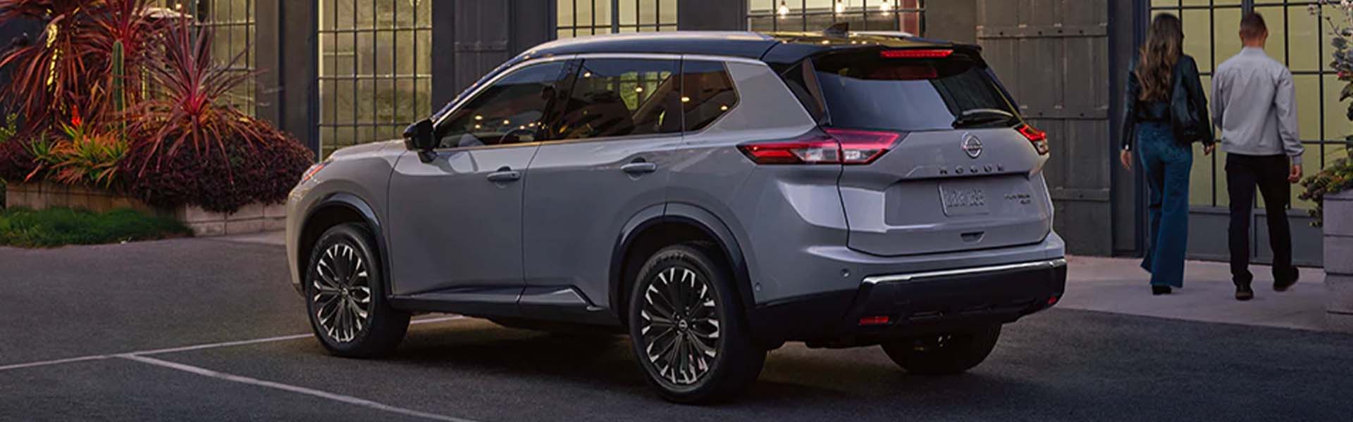 A gray suv sitting parked.