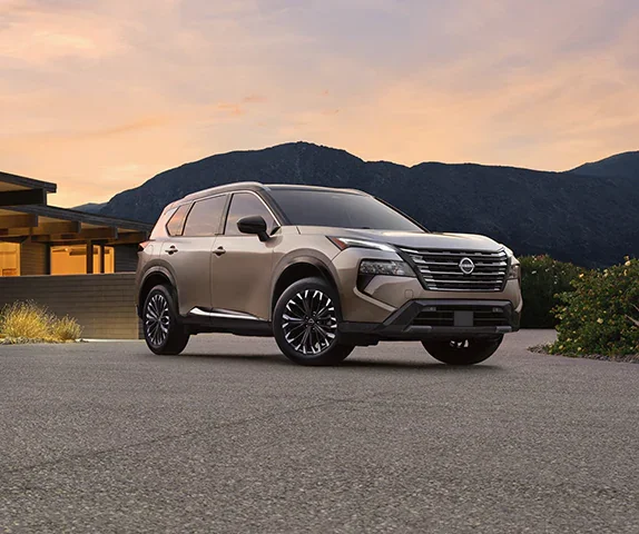 A woman walking away from a brown suv.