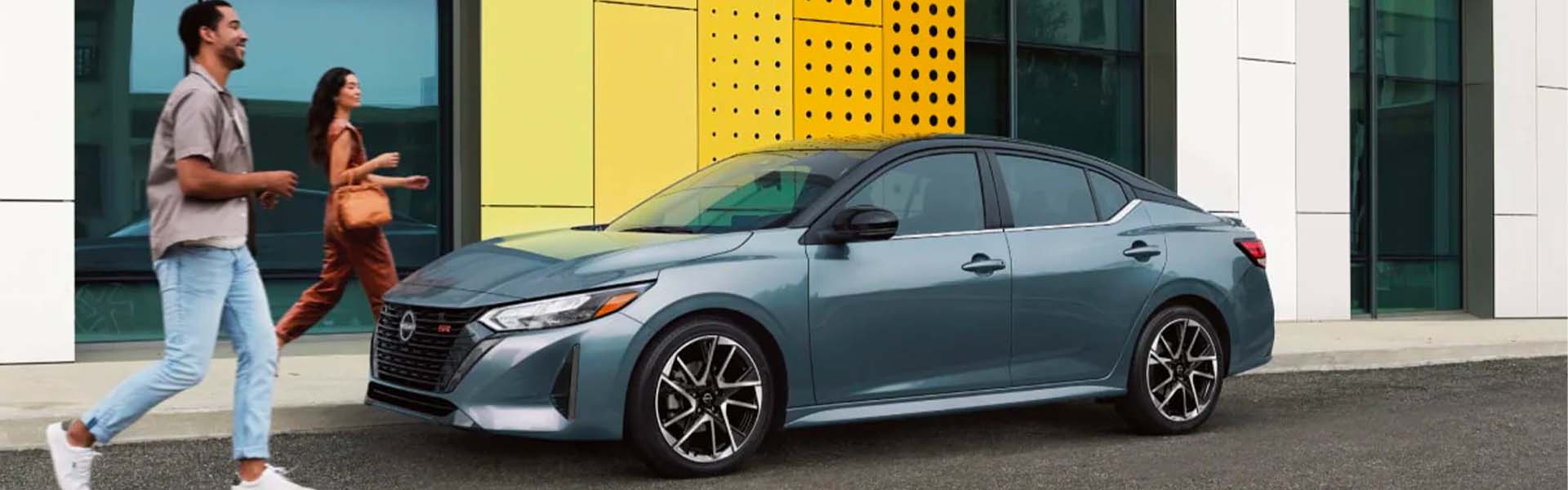 A red car driving on the road.