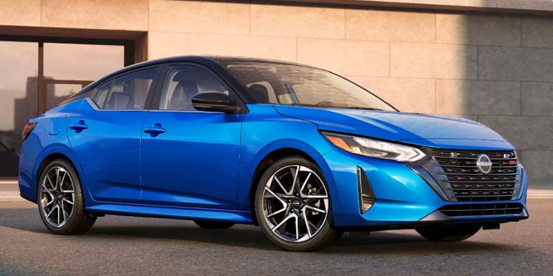 A blue car sitting parked.