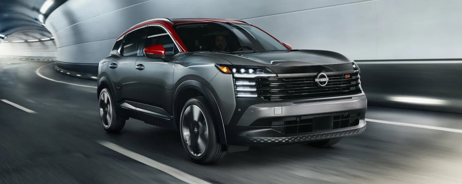 a steel gray exterior view of a compact suv driving