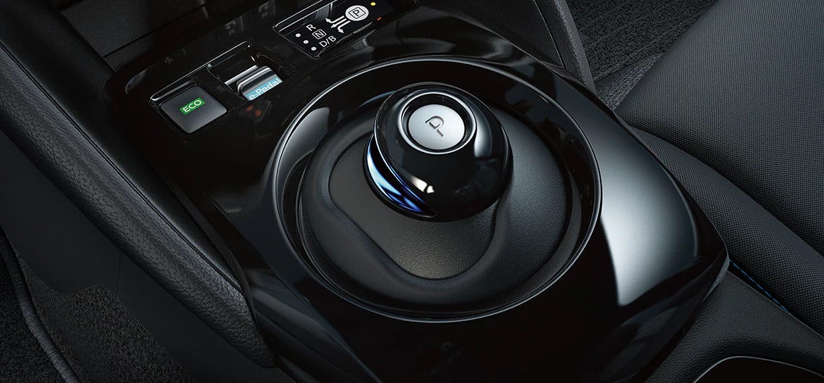 A close-up of the gear selector in the 2025 Nissan Leaf, showcasing the minimalist design and user-friendly controls.