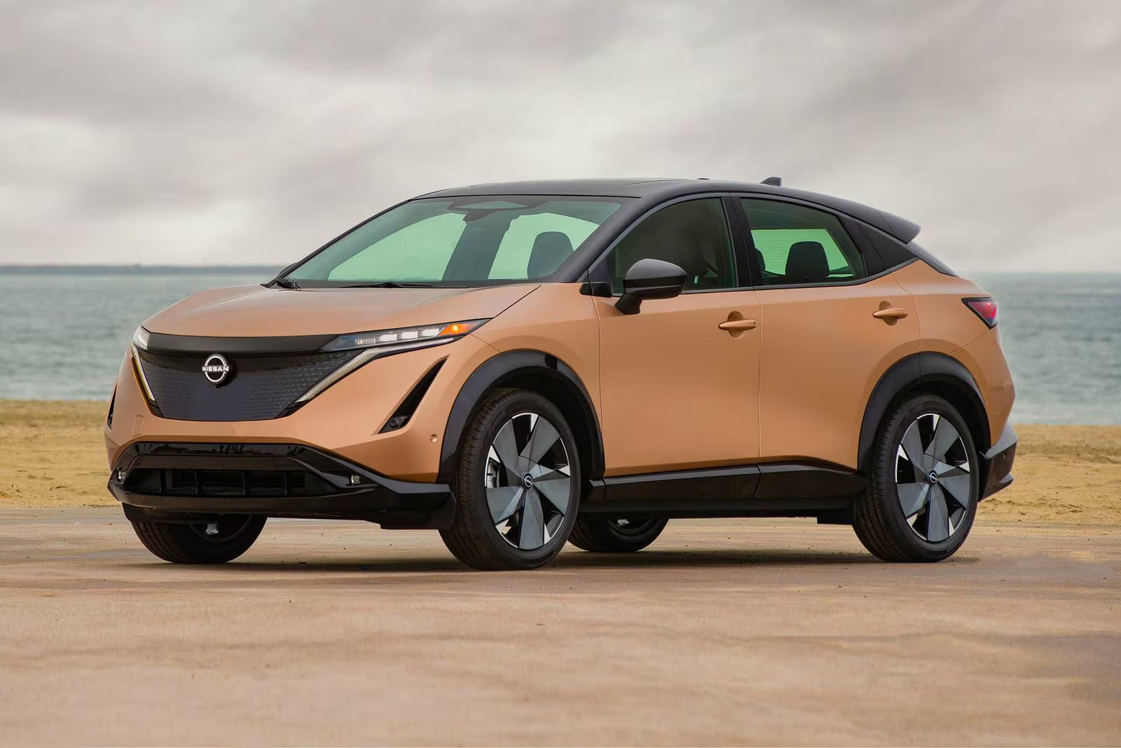 A brown car sitting parked.