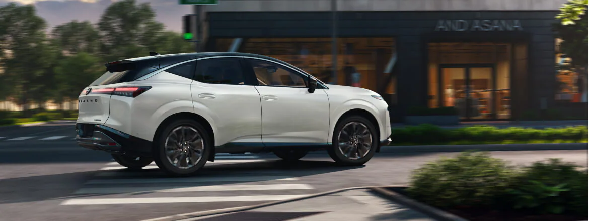 2025 Nissan Murano in driveway of oceanside home