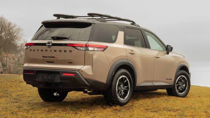 A brown suv sitting parked.