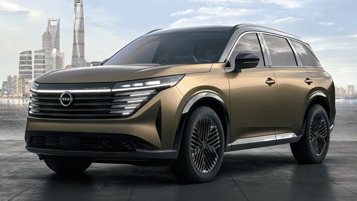 A green suv sitting parked.