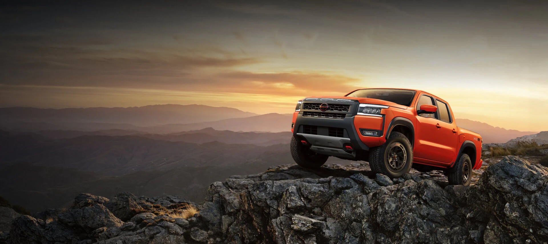 2026 nissan frontier driving on a dirt path