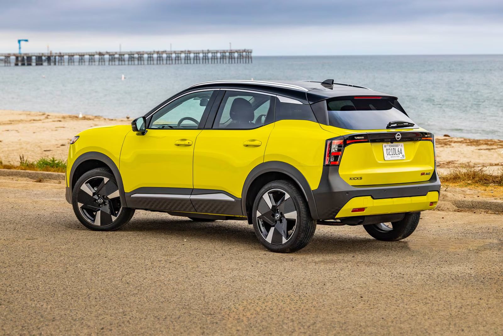 A yellow car sitting parked.