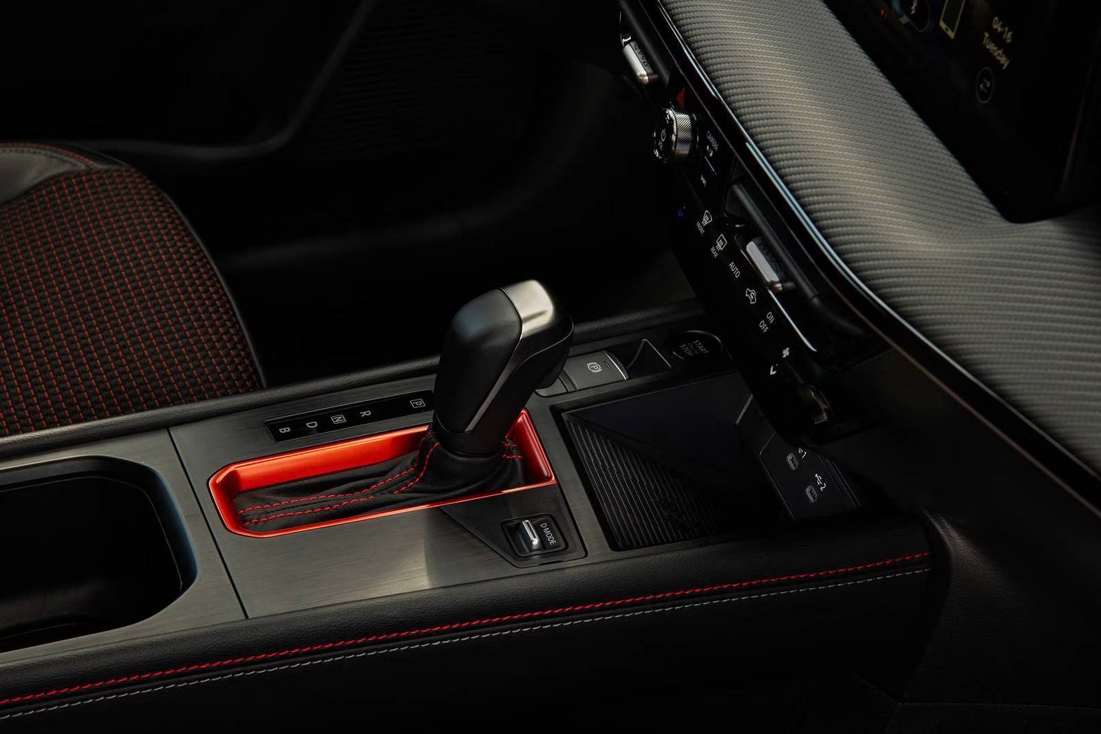The gear shift in the nissan kicks.