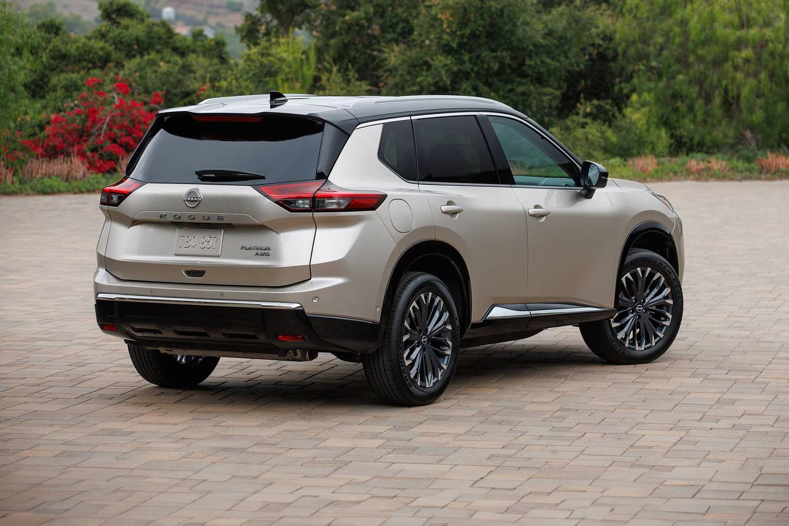 A silver car sitting parked.