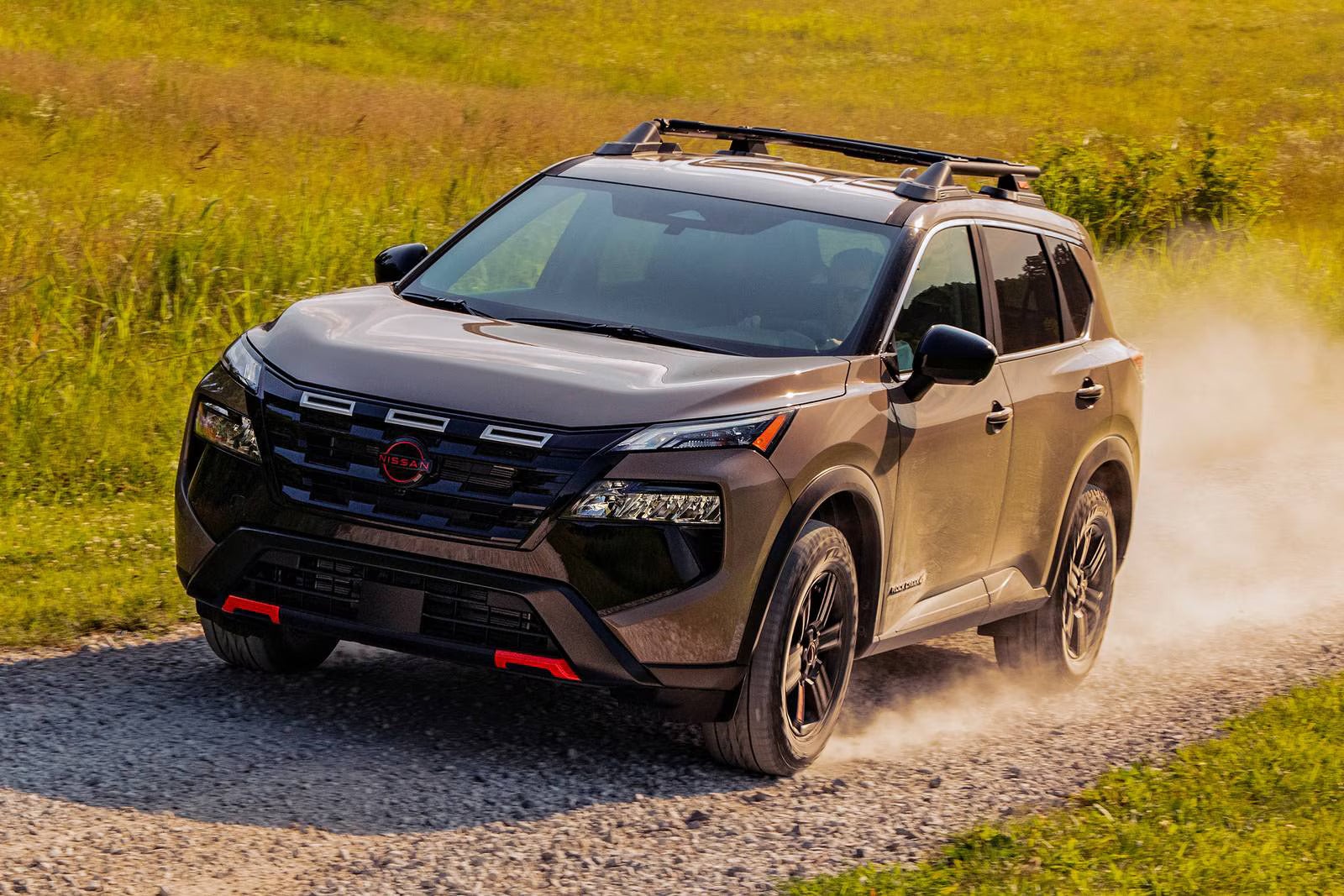 A brwon nissan driving off-road.