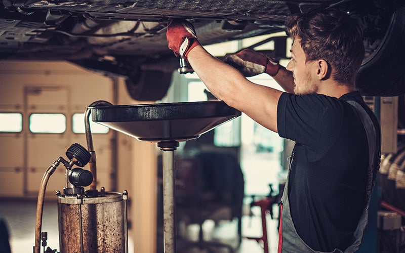 The oil being changed on a car.